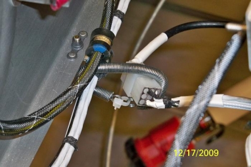 Springs wrapped around the GPS and the Fuel Guardian wires to prevent the GPS antenna wire from hangin