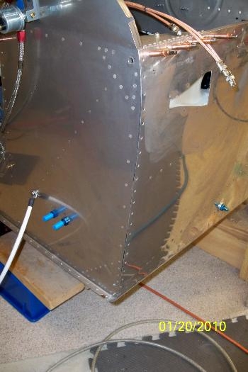 Temporary poprivets were drilled out of the fuselage skin and firewall