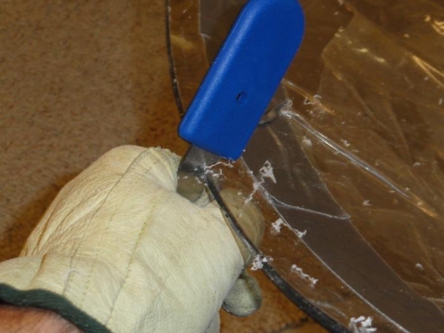 Using the plexiglass scraper for the initial cleaning up