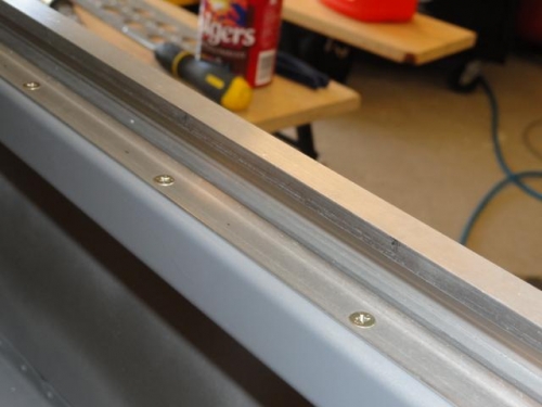 The canopy side rails with countersunk holes
