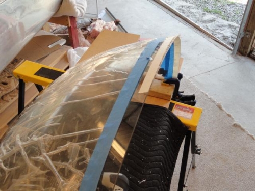 The windshield with tape applied for sanding