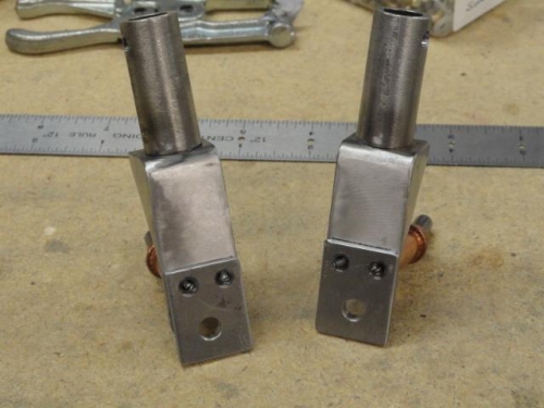 The roller weldments and the stops drilled together