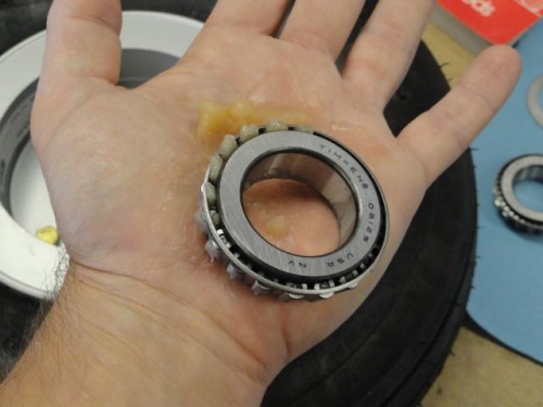 One wheel bearing partially packed