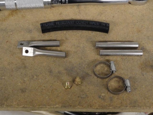 Components of the center hanger which will connect the two exhaust hangers