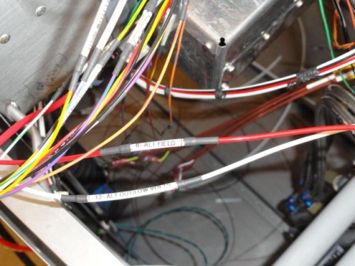 Red wire is the alternator field wire--white wire is alt out/low volts