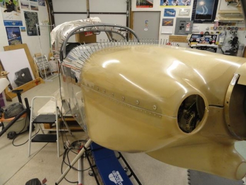 The two cowling halves are in place on the aircraft