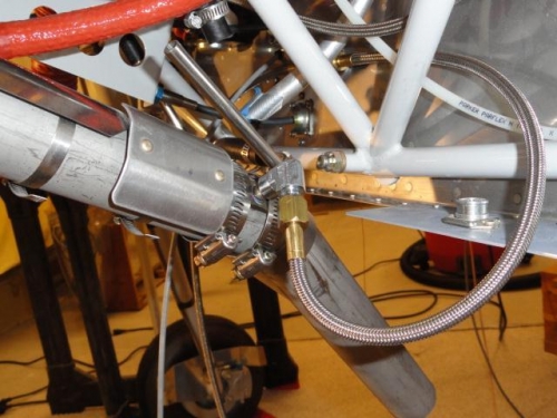 The injector inserted in the exhaust and the clamps applied