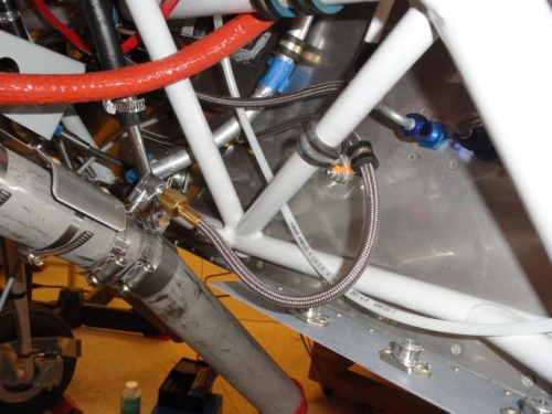 The left smoke hose clamped in place