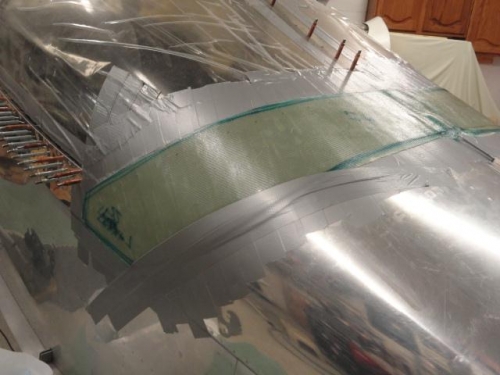 The left side with the duct tape placed over the aft edge