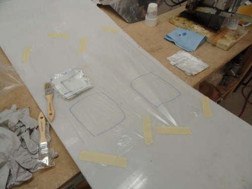 The plastic ready for the epoxy resin and the fiberglass