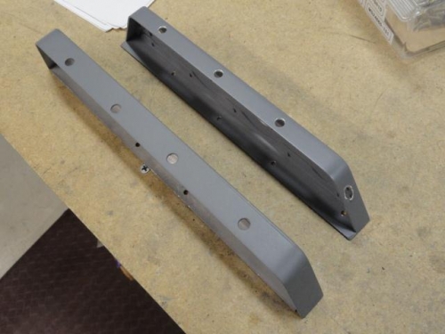 The access holes in both brackets