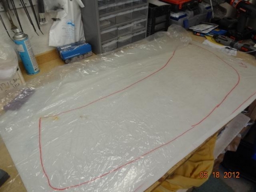 The plastic sheet with the outline of the cloth drawn on it