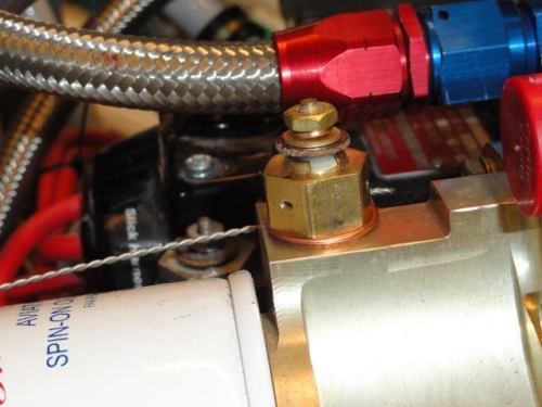 The oil temp sensor with a hole drilled for the safety wire