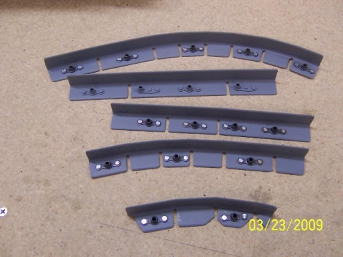 The nutplates riveted to the angle brackets