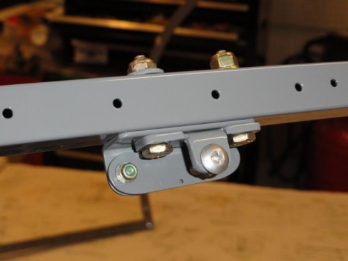 The tip-up mod hardware on the right canopy bow which the support strut will attach to