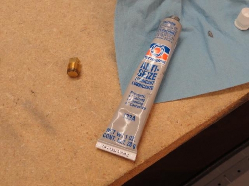 An AN913-1 brass plug and the Permatex Anti-Seize to be screwed into a primer plug