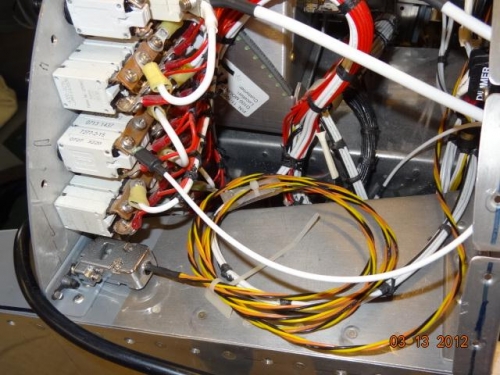 The smoke system power wire attached to the bus bar