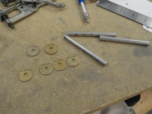 The large washers marked for trimming with the screw tubes
