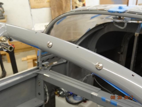 The screws in place on the roll bar