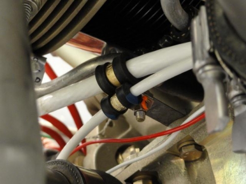 The alternator and starter cable clamped