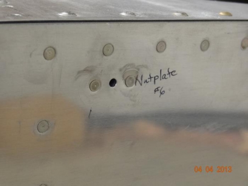 The nutplate in place on the left side of the fuselage