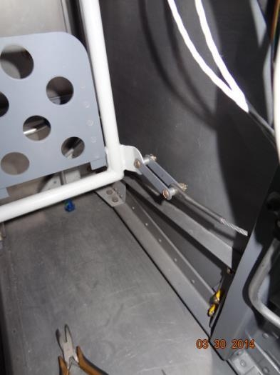 The right rudder pedal screws with cotter pins installed