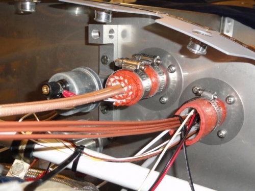 The Lightspeed ignition wires wrapped in the firewall pass-through