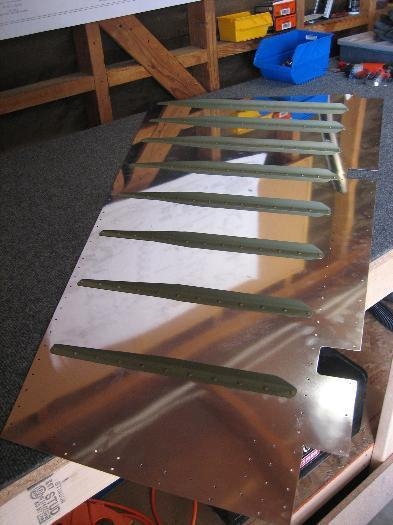 Riveted Right Rudder Stiffeners to skin.