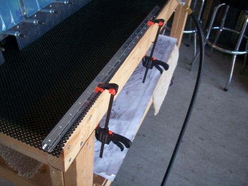 clamping down the spar for countersinking the holes on top