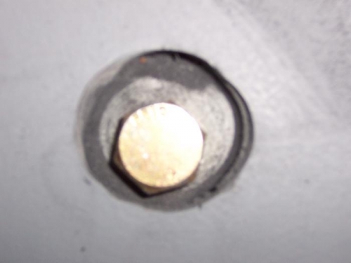 lower holes caught carbon uni-strip; bolt head in