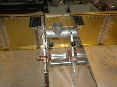 Flap actuator clecoed in-place