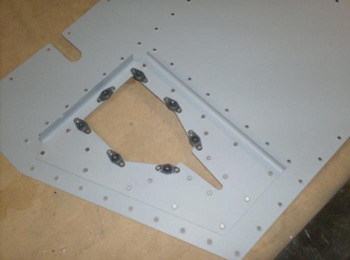 Reinforcement plates riveted to skins