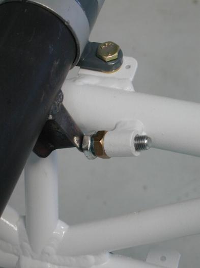 Aileron stop bolt in contact with torque tube arm