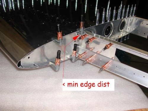 topmost hole below min edge distance