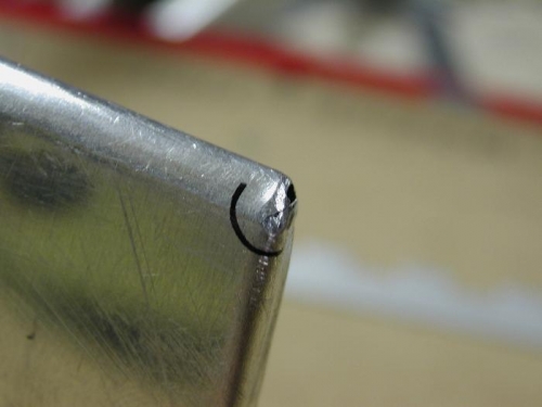 small crack at end of tab