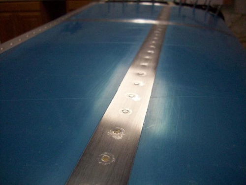 Bottom side flush rivets.