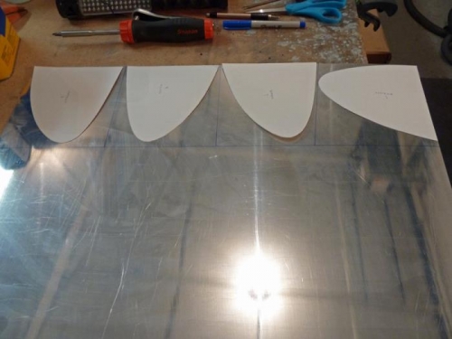 Cardboard templates for the four wingtip light reflectors.