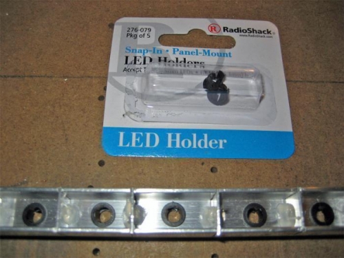 Radio Shack sells some nice LED holders (Cat #276-079) that fit in 1/4