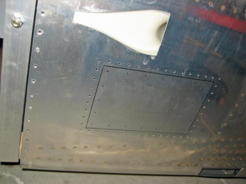 This shows the placement of the hatch. The skin will be cut along the black line.