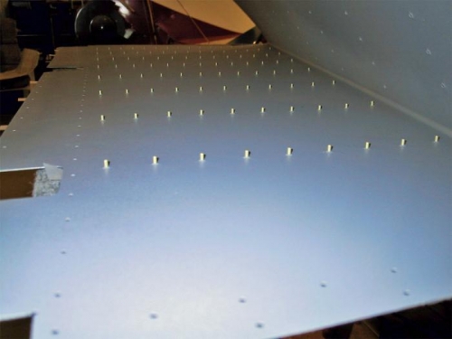 A forest of rivets, ready for the stiffeners.
