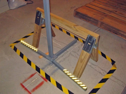 The airplane's tail will be supported by this stubby sawhorse with a notch cut in it.