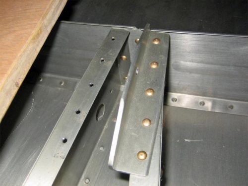 Half of the pre-existing elevator bellcrank bracket has been drilled out. Second half to go.
