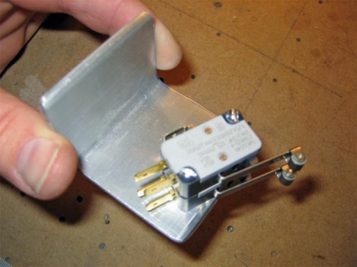 The placement of the two microswitches on the mounting plate.