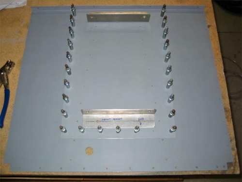 The baggage compartment floor, doubler plate, and reservoir attach angles.