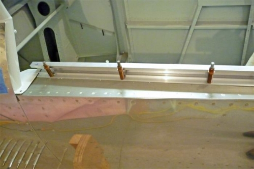 Part-way through the process of enlarging the attach holes.