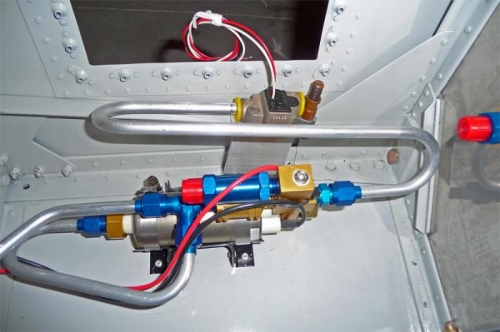 Installation of the fuel line between the fuel pump and the flow transducer.
