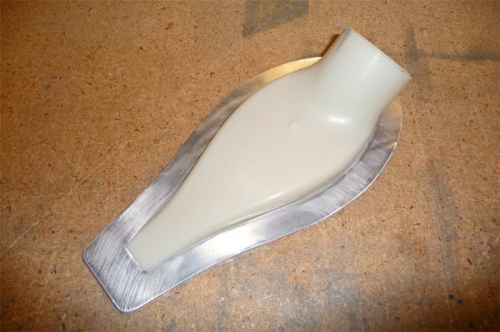 The backing ring, fitted to the plastic scoop.