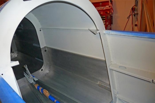 Aft baggage compartment and left sidewall of rear cockpit.