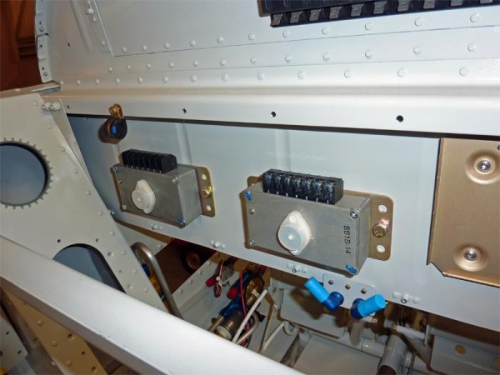 Alternator controllers mounted to avionics bulkhead.