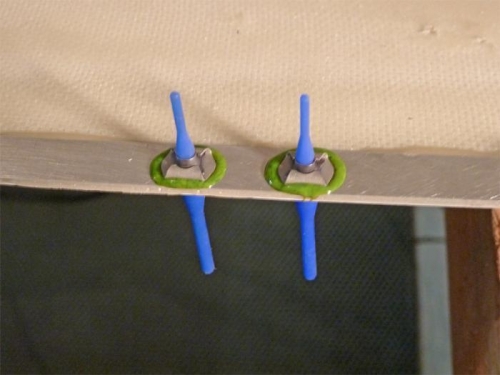 ClickBond nutplates. The blue rubber stems will be pulled out after the adhesive cures.